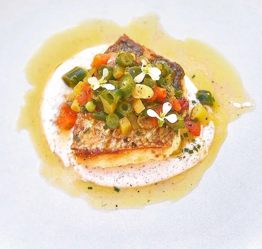 Mahi with Spring Crudo Over Smashed Pea & Cauli Puree