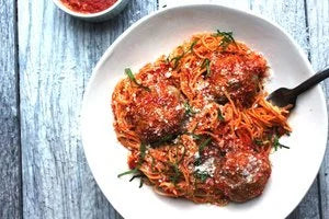Garlic Turkey Meatballs Cooked in Brothy Tomato Sauce
